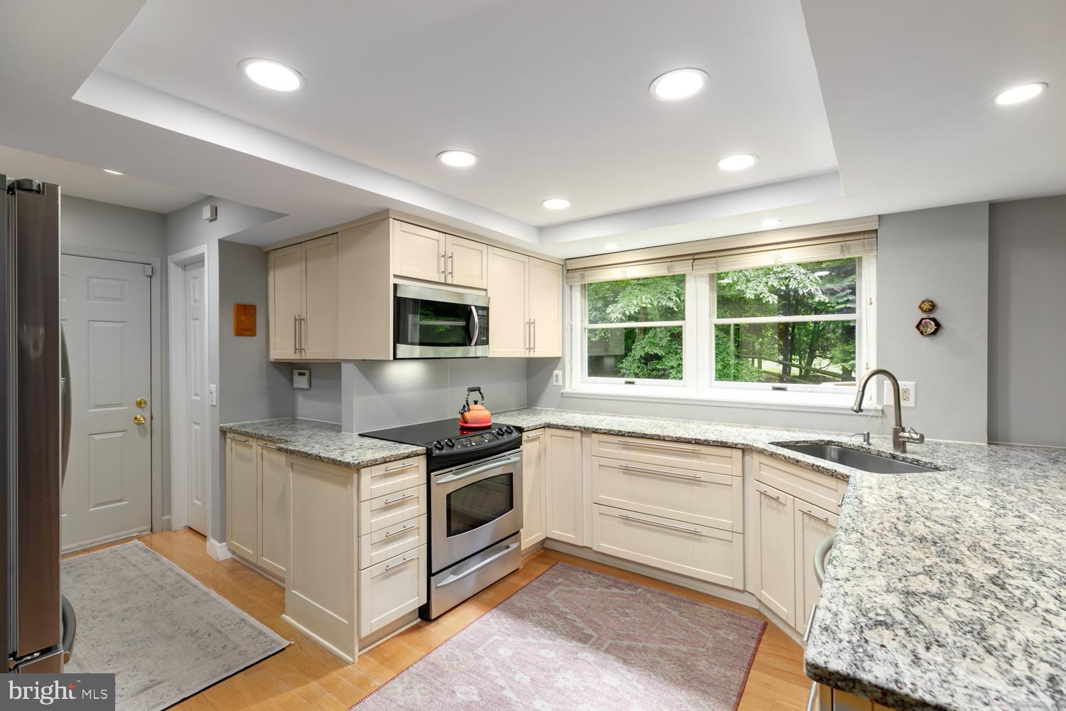 11603 Deer Forest Road Reston, VA 20194 - Photo 6 of 38 a kitchen with stainless steel appliances granite countertop a stove and a sink