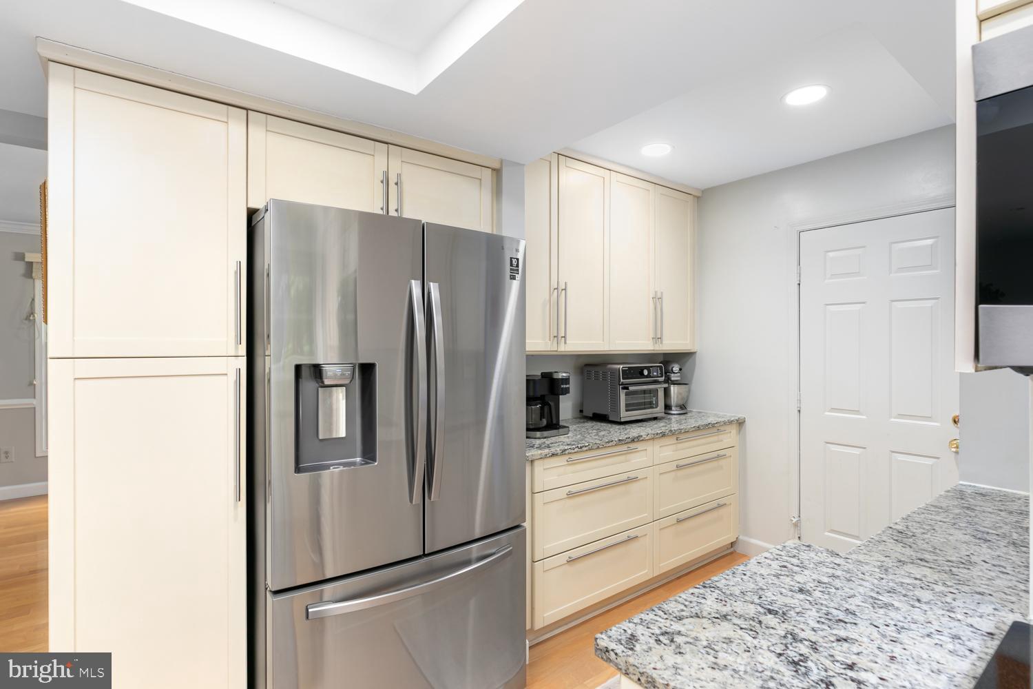11603 Deer Forest Road Reston, VA 20194 - Photo 7 of 38 a kitchen with stainless steel appliances granite countertop a refrigerator and a stove