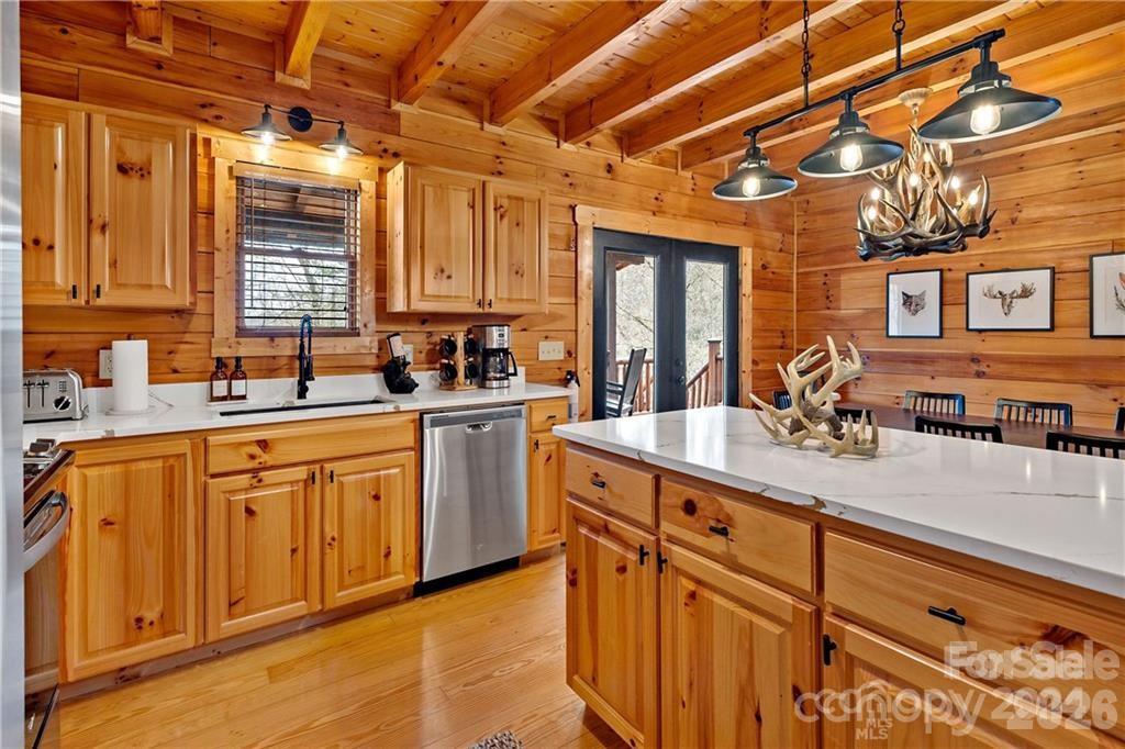 552 Lake Road Old Fort, NC 28762 - Photo 14 of 46 a kitchen with sink a window and chairs
