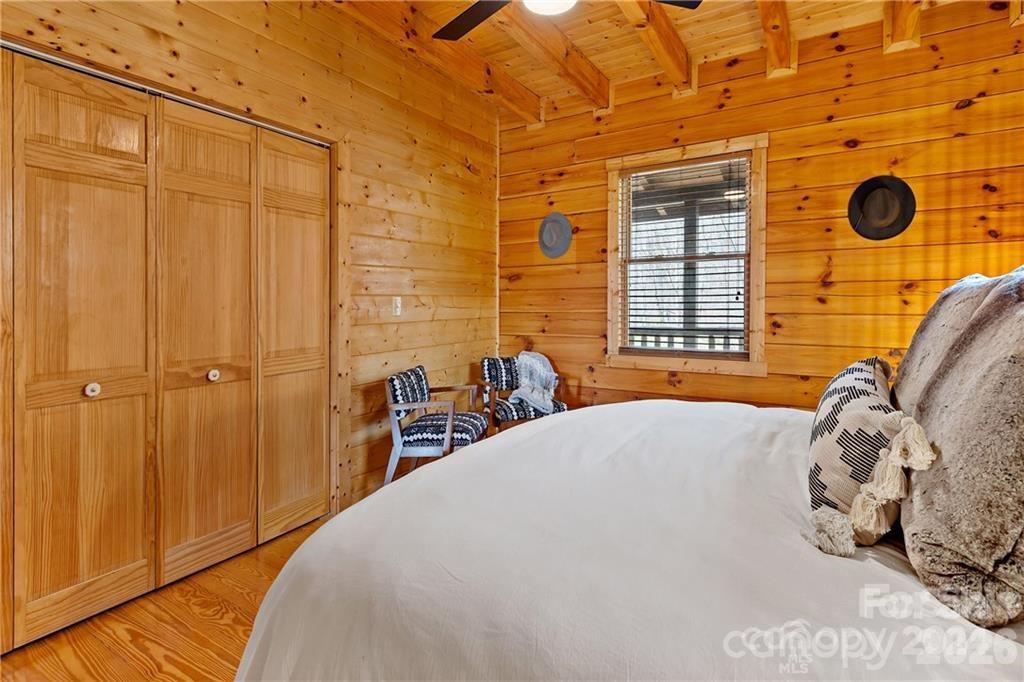552 Lake Road Old Fort, NC 28762 - Photo 16 of 46 a bedroom with a bed and a window