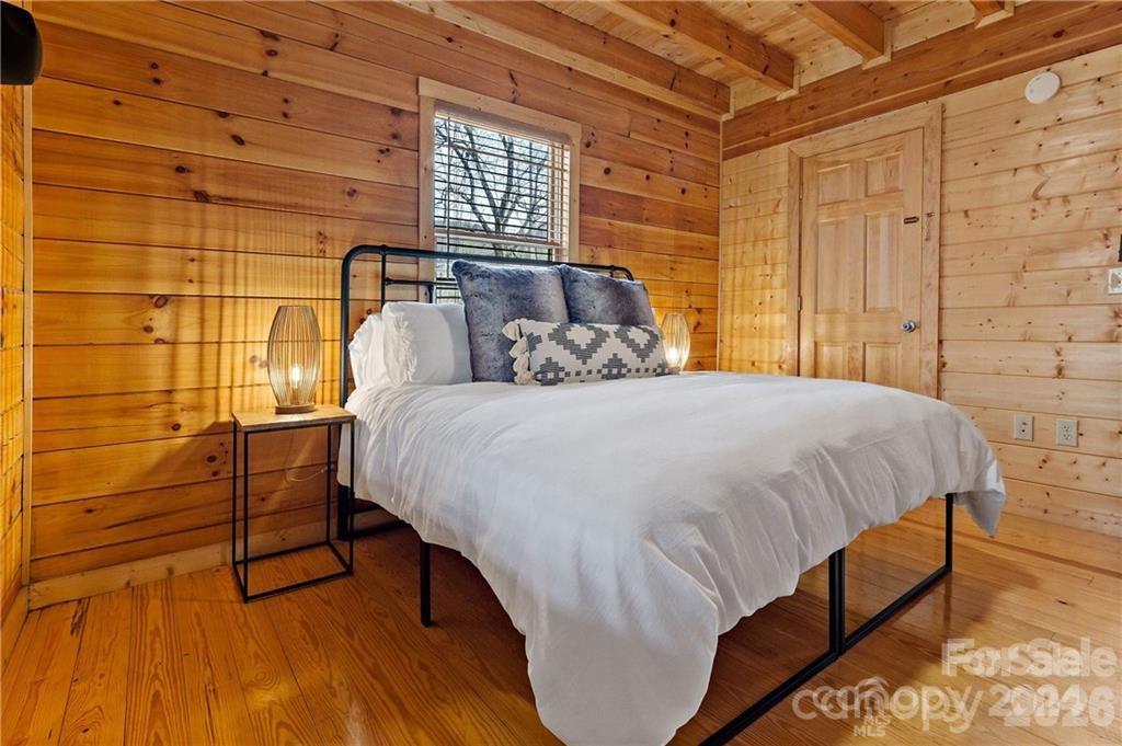 552 Lake Road Old Fort, NC 28762 - Photo 17 of 46 a bedroom with a bed and a window