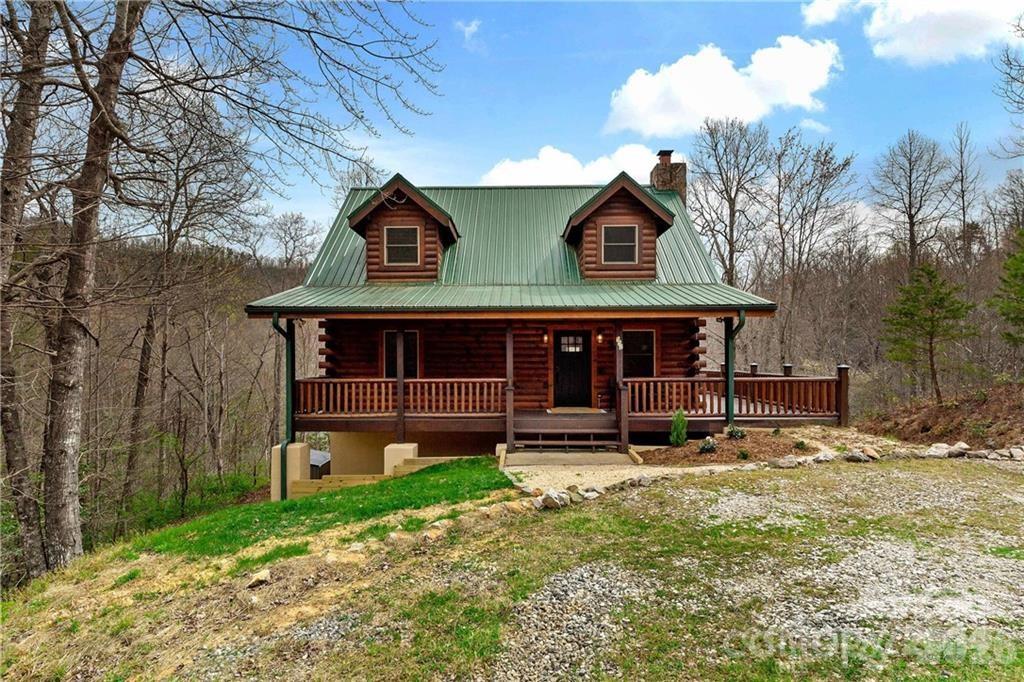 552 Lake Road Old Fort, NC 28762 - Photo 2 of 46 a view of a house with a yard and large tree