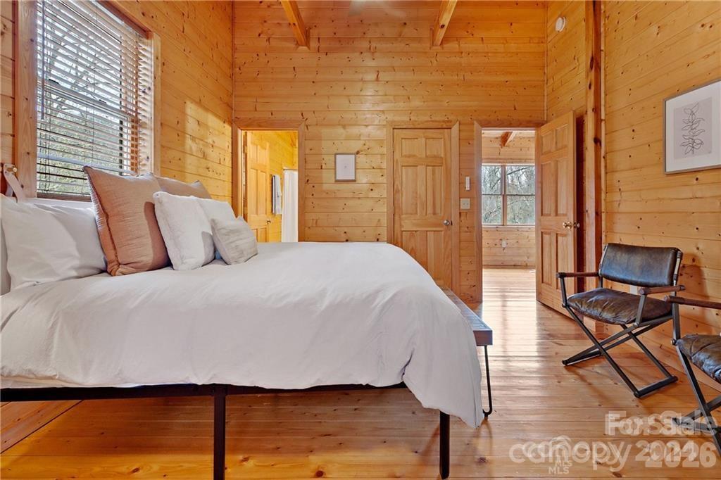 552 Lake Road Old Fort, NC 28762 - Photo 23 of 46 a large bed sitting in a bedroom next to a window