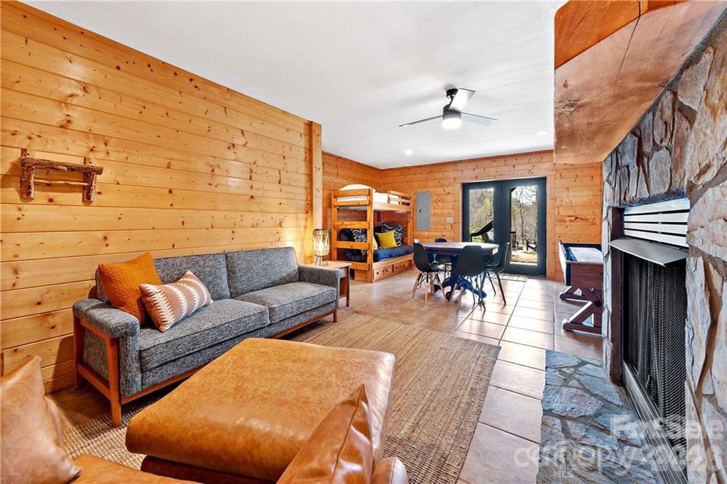 552 Lake Road Old Fort, NC 28762 - Photo 29 of 46 a living room with furniture a fireplace and a large window