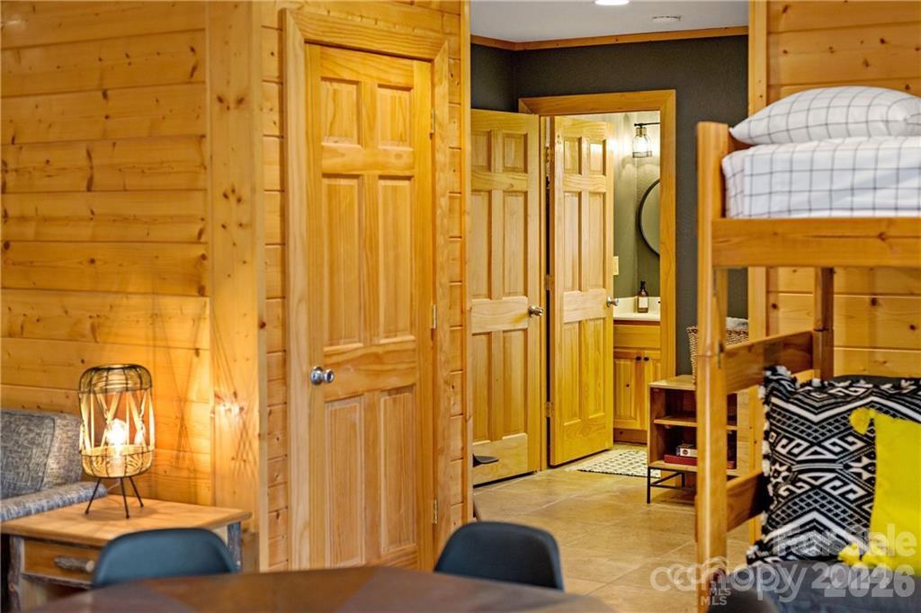 552 Lake Road Old Fort, NC 28762 - Photo 32 of 46 a bedroom with a bed and wooden floor