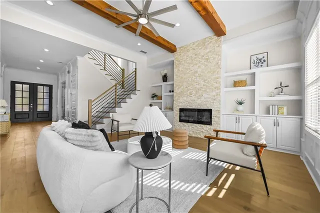 a view of dining room and kitchen with furniture wooden floor kitchen chandelier