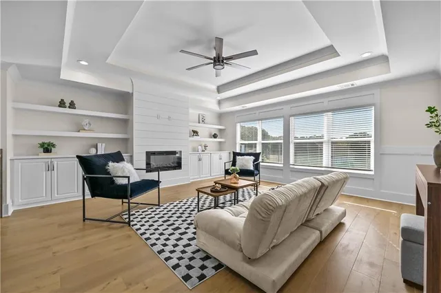a bedroom with a bed and a ceiling fan