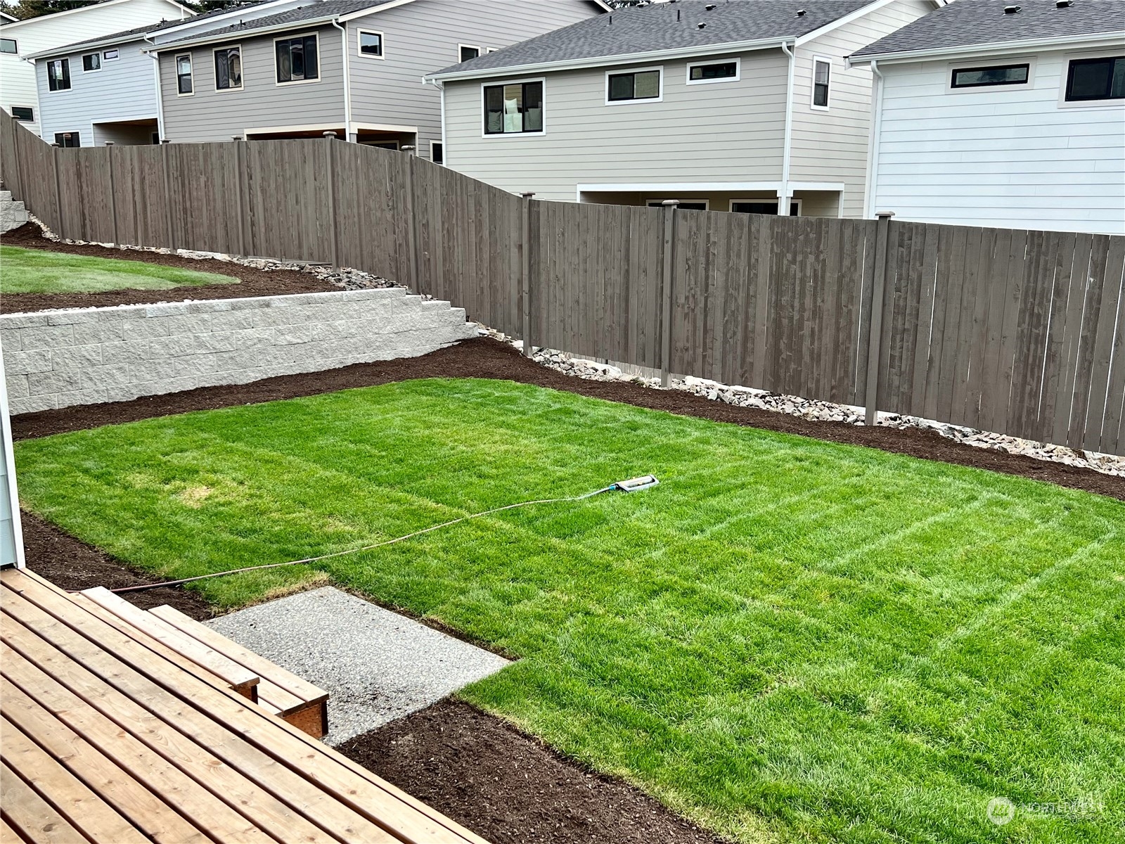 4324 243rd Place Southeast, Unit LOT47 Bothell, WA 98021 - Photo 3 of 39 a view of a backyard with a garden