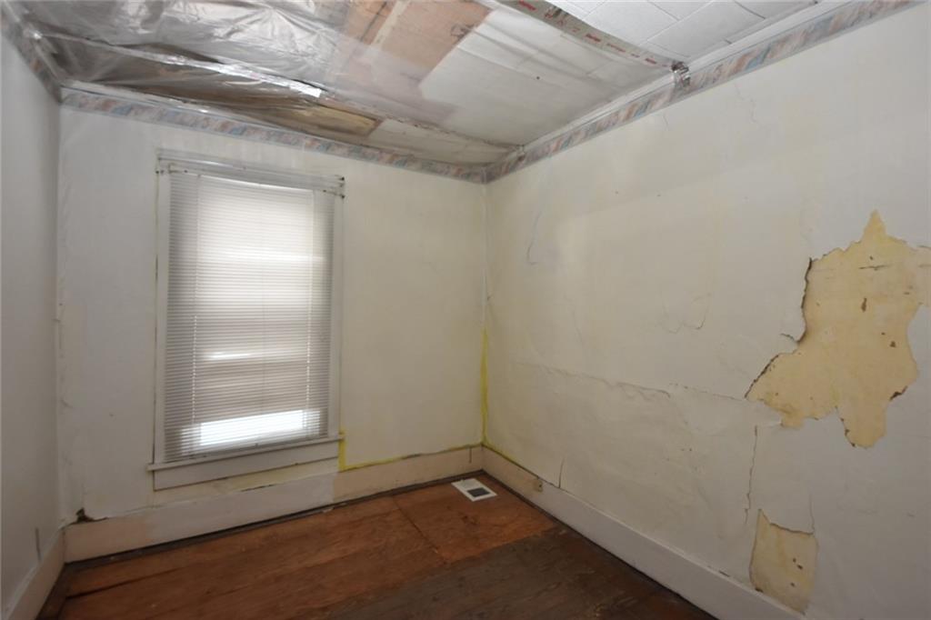 1845 Savannah Road New Castle, PA 16101 - Photo 16 of 21 2nd floor bedroom needs remodeled. Plastic on the ceiling is to keep blown-in insulation in attic in place.