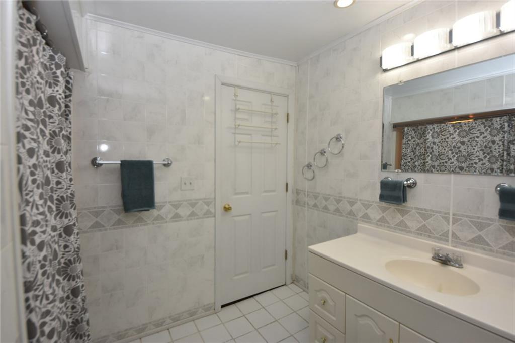 1845 Savannah Road New Castle, PA 16101 - Photo 5 of 21 Upgraded bathroom is very large 8'x 8' Surround tub & Shower, large vanity, ceramic tile flooring and easy care walls.