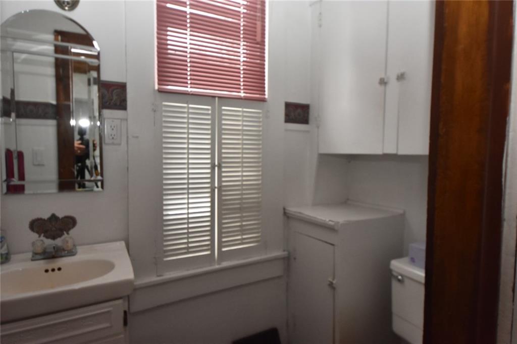 1845 Savannah Road New Castle, PA 16101 - Photo 9 of 21 A convenient powder room on the main floor is off the kitchen.