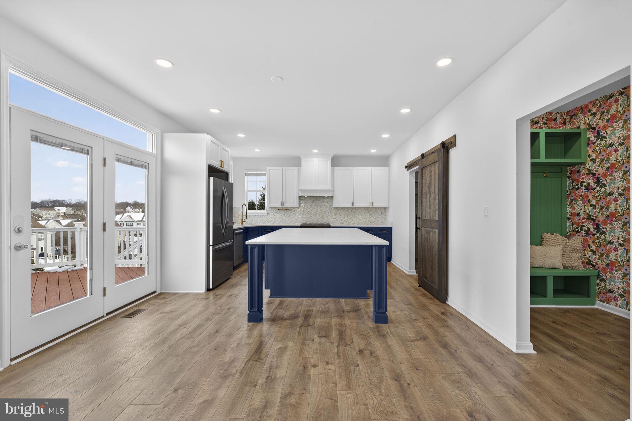 43132 Butterfly Way Leesburg, VA 20176 - Photo 13 of 63 a view of kitchen with refrigerator microwave and wooden floor