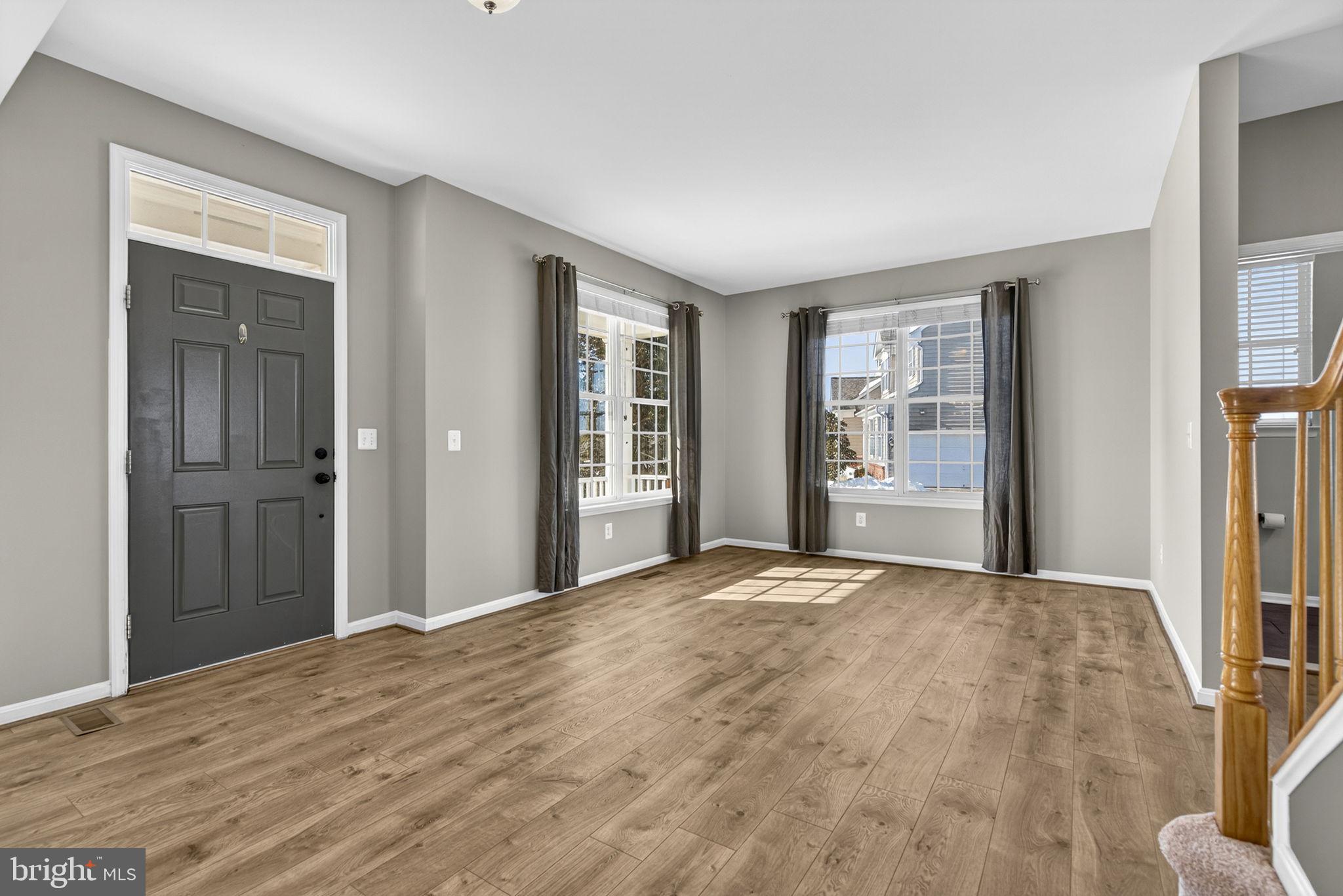 43132 Butterfly Way Leesburg, VA 20176 - Photo 18 of 63 a view of an empty room with wooden floor and a window
