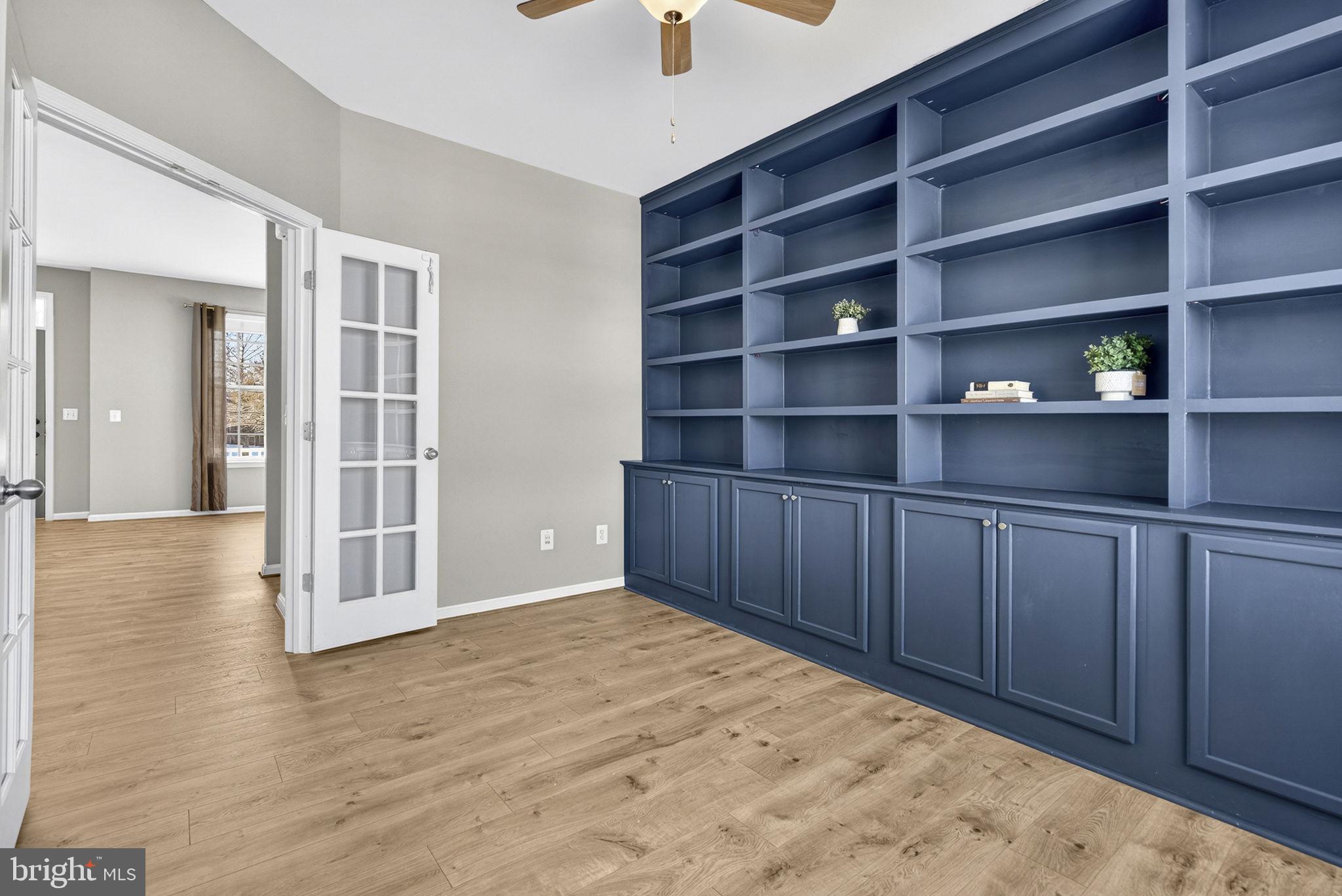 43132 Butterfly Way Leesburg, VA 20176 - Photo 22 of 63 a view of an empty room with shelves and wooden floor