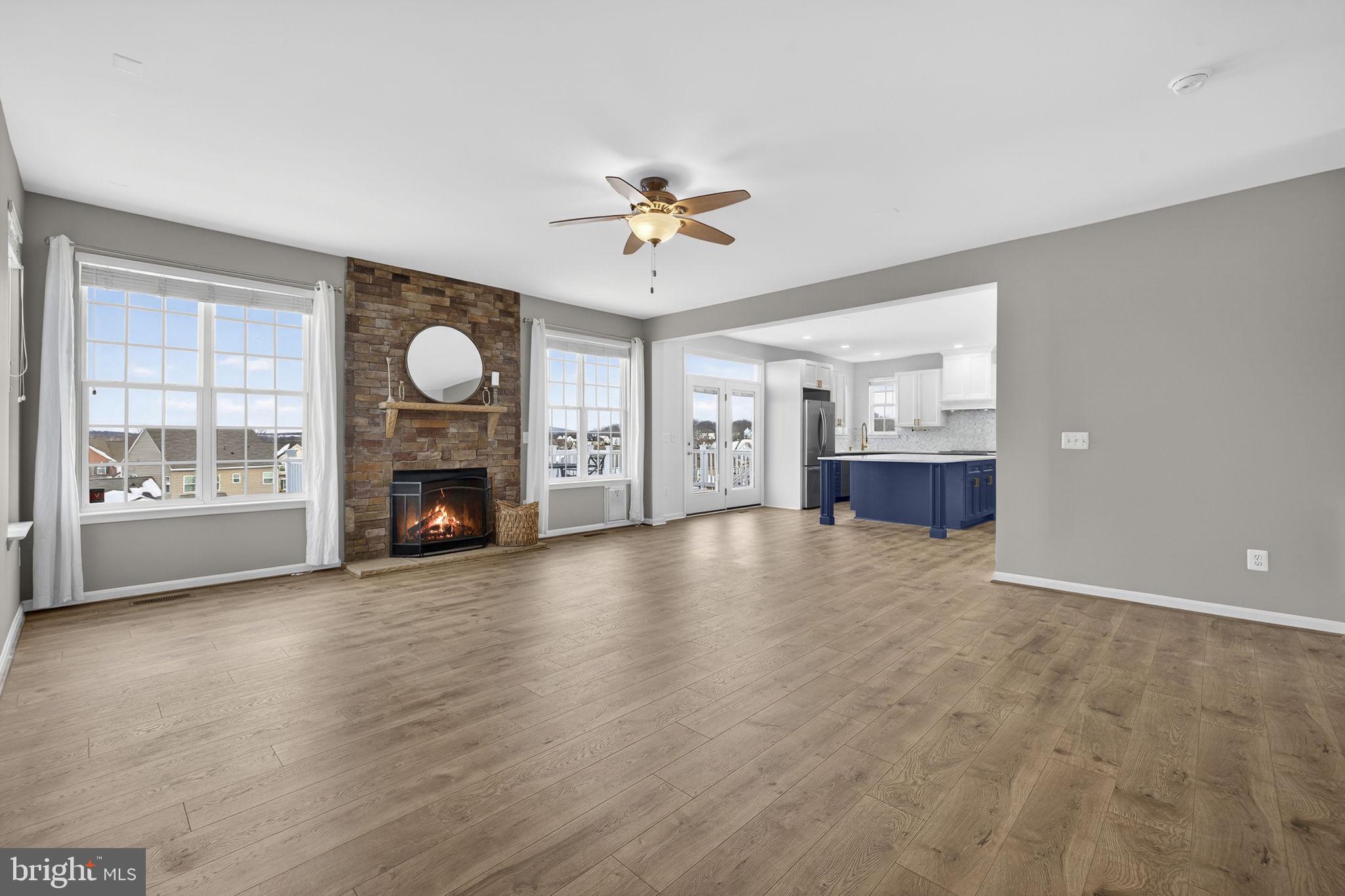43132 Butterfly Way Leesburg, VA 20176 - Photo 24 of 63 a view of empty room with fireplace and fan