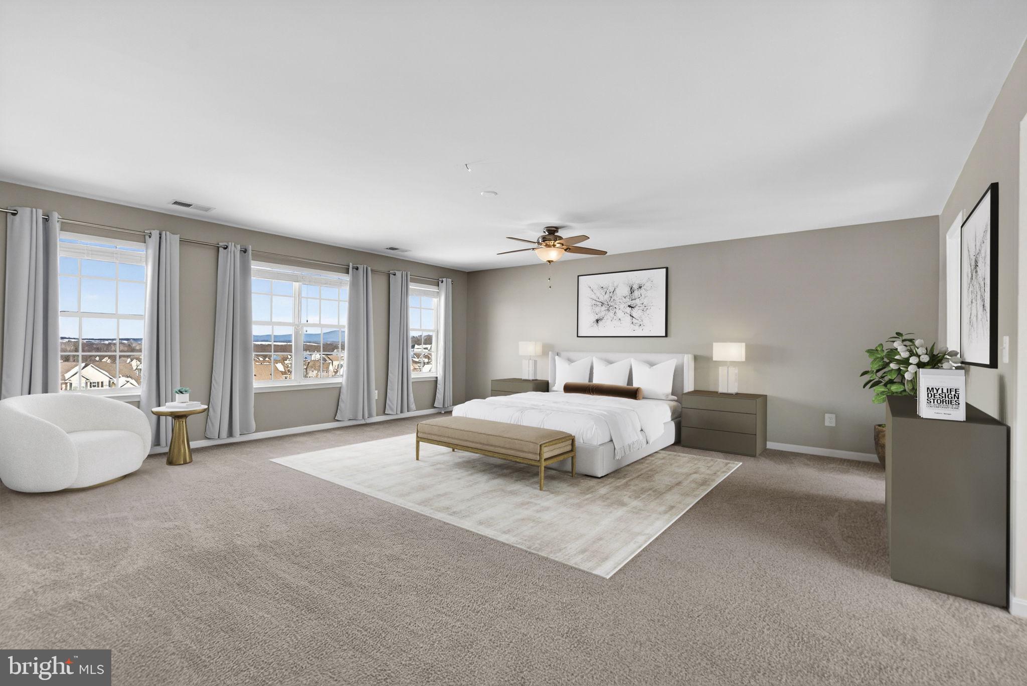 43132 Butterfly Way Leesburg, VA 20176 - Photo 28 of 63 a spacious bedroom with a bed and a couch