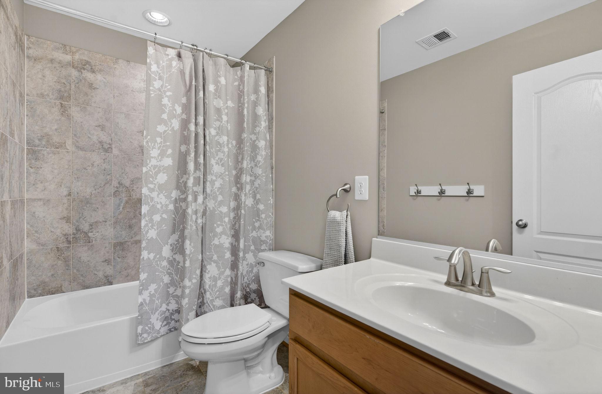 43132 Butterfly Way Leesburg, VA 20176 - Photo 39 of 63 a bathroom with a sink toilet and shower