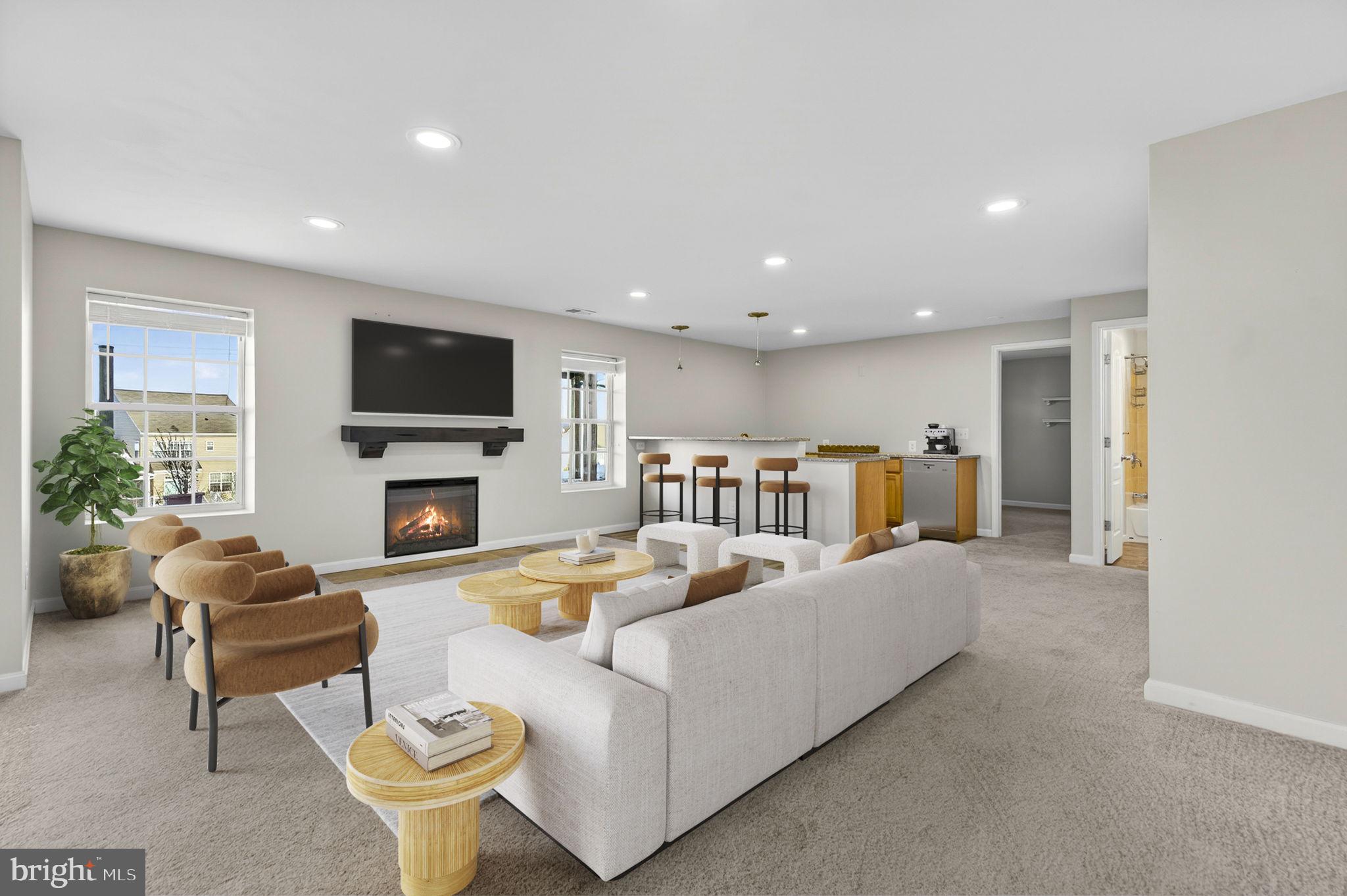 43132 Butterfly Way Leesburg, VA 20176 - Photo 42 of 63 a living room with furniture and a flat screen tv