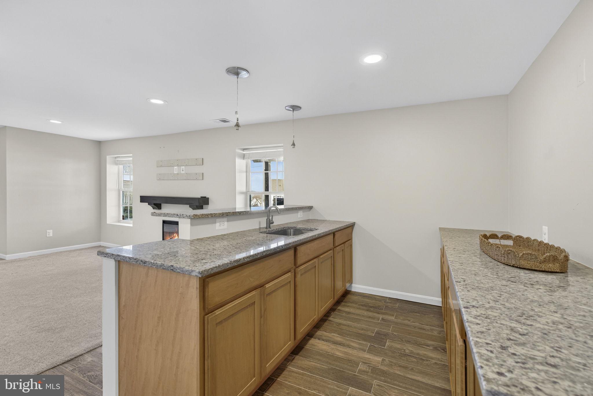 43132 Butterfly Way Leesburg, VA 20176 - Photo 46 of 63 a kitchen with a sink and a stove top oven