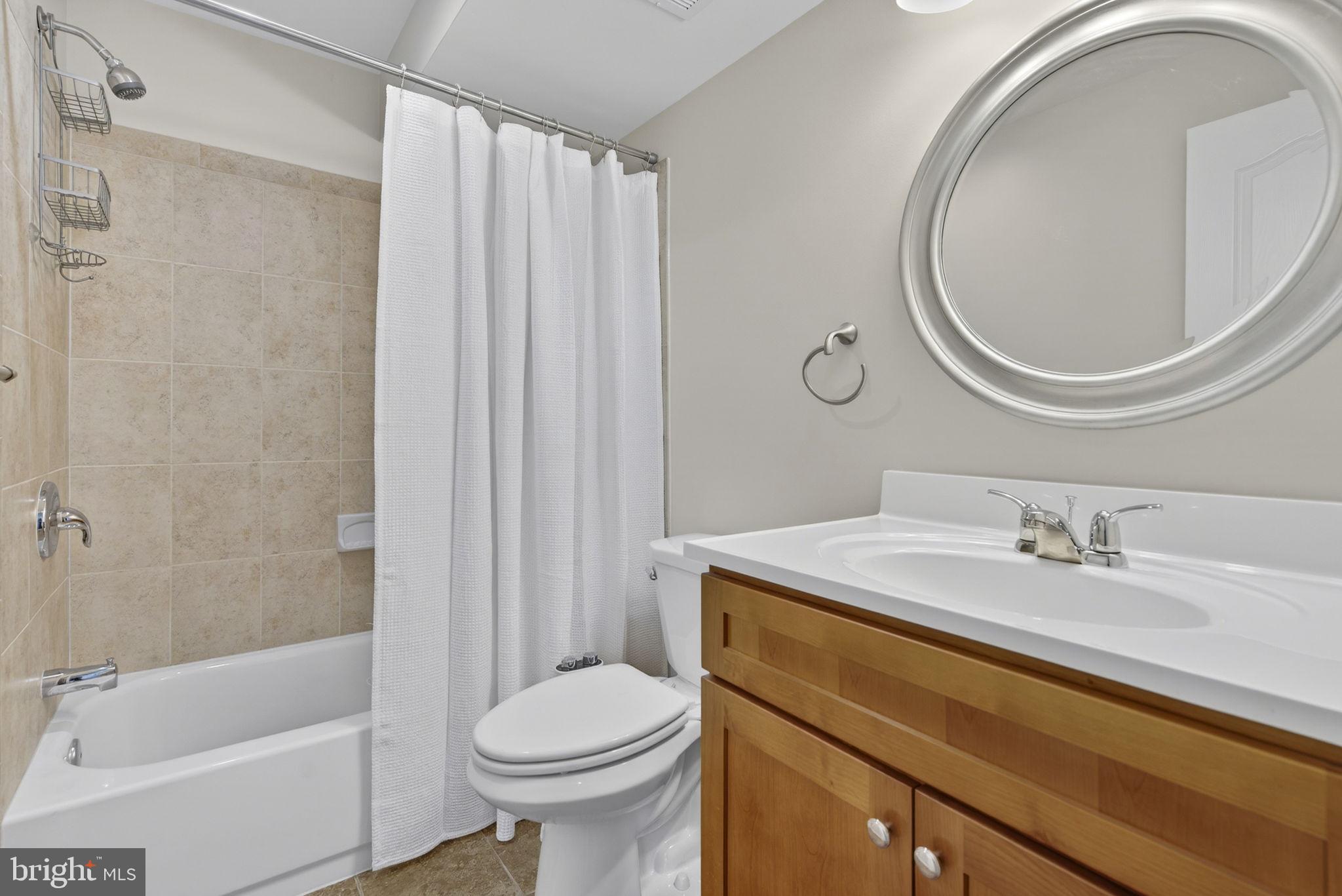 43132 Butterfly Way Leesburg, VA 20176 - Photo 49 of 63 a bathroom with a sink a toilet and a mirror