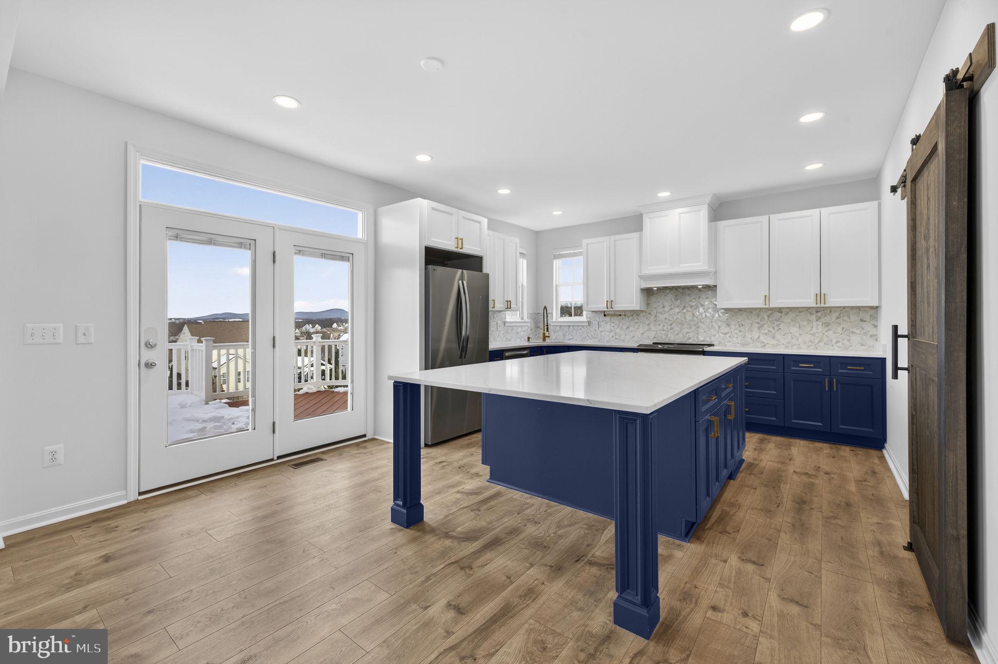 43132 Butterfly Way Leesburg, VA 20176 - Photo 10 of 63 a kitchen with stainless steel appliances granite countertop a sink counter space and cabinets