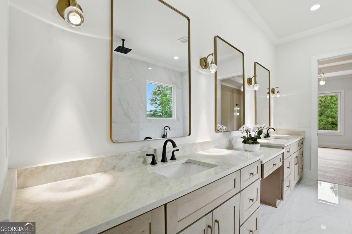 1557 Whitley Road Dacula, GA 30019 - Photo 21 of 46 a bathroom with a sink and a mirror