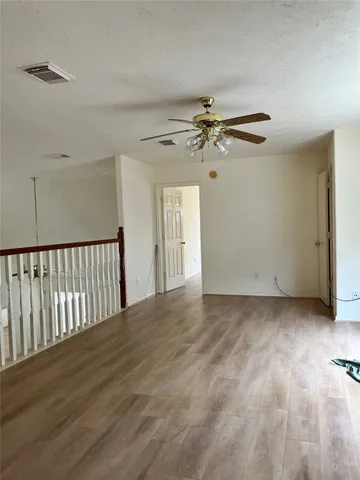 a view of a livingroom with a ceiling fan