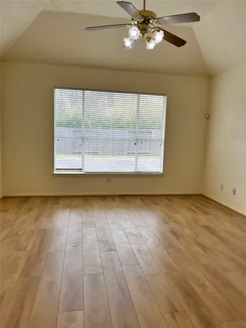 a view of an empty room with a window