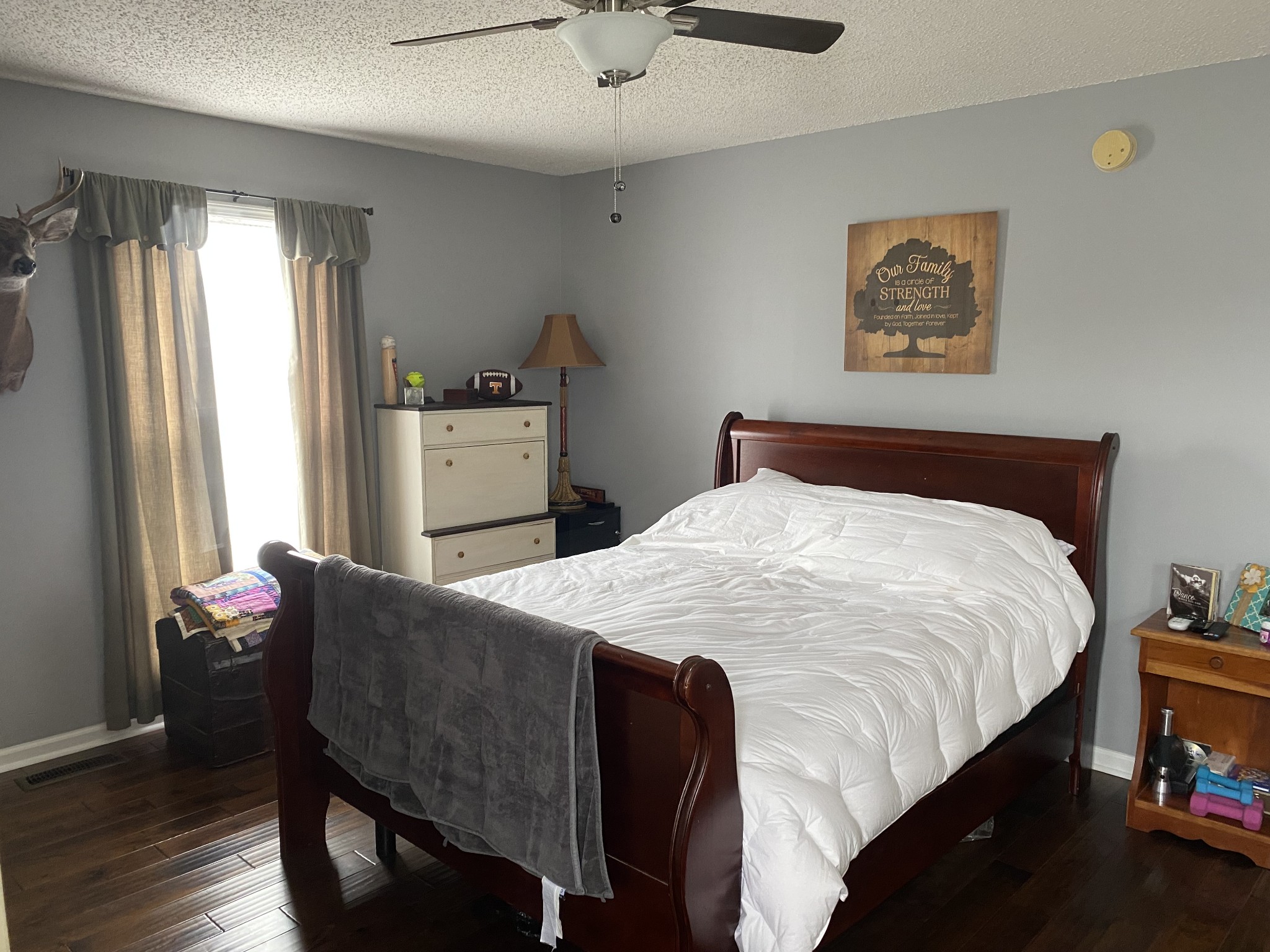 876 Barnette Road Minor Hill, TN 38473 - Photo 11 of 27 a bedroom with a bed and a chandelier