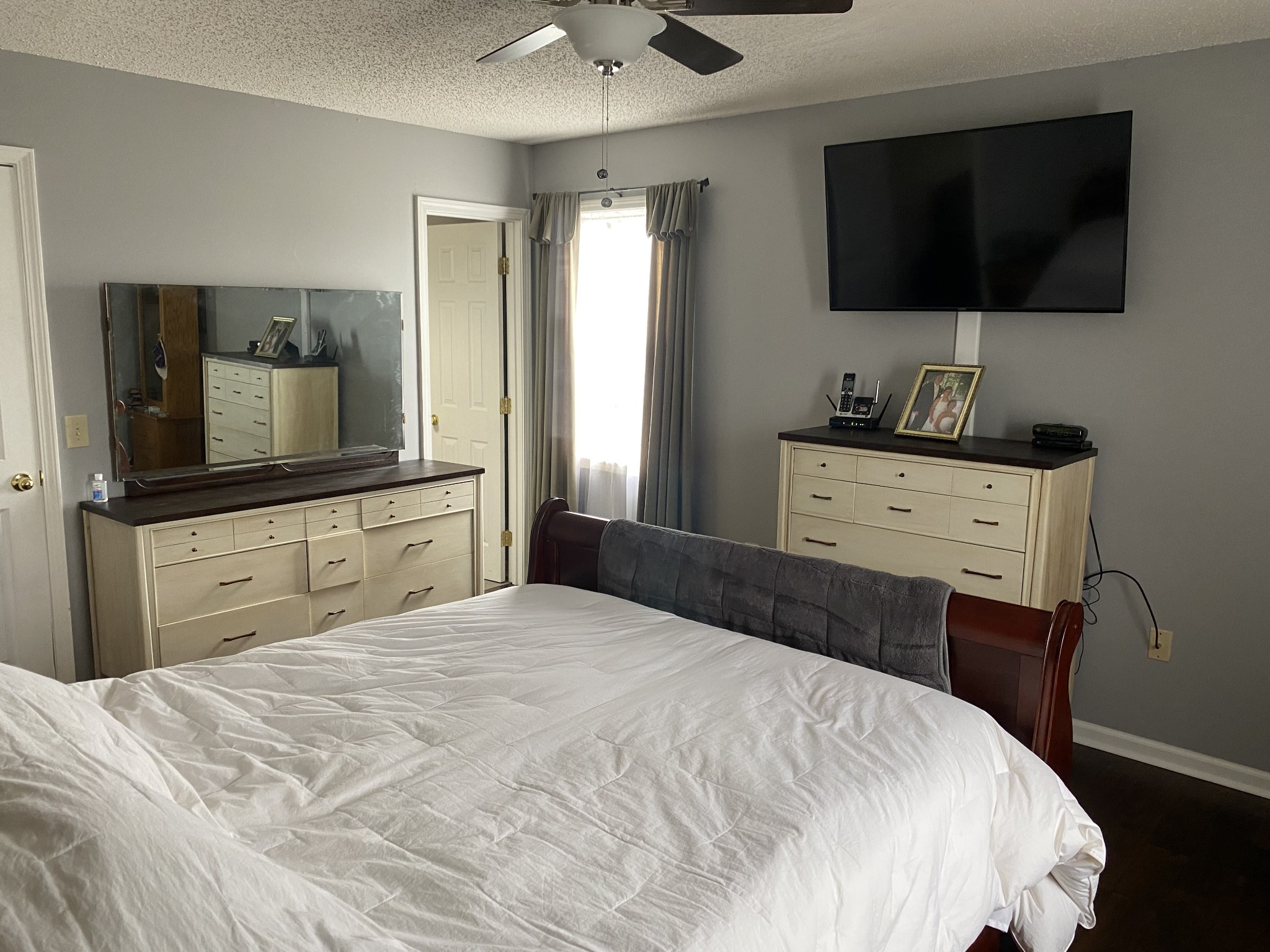 876 Barnette Road Minor Hill, TN 38473 - Photo 12 of 27 a bedroom with a bed and a flat screen tv