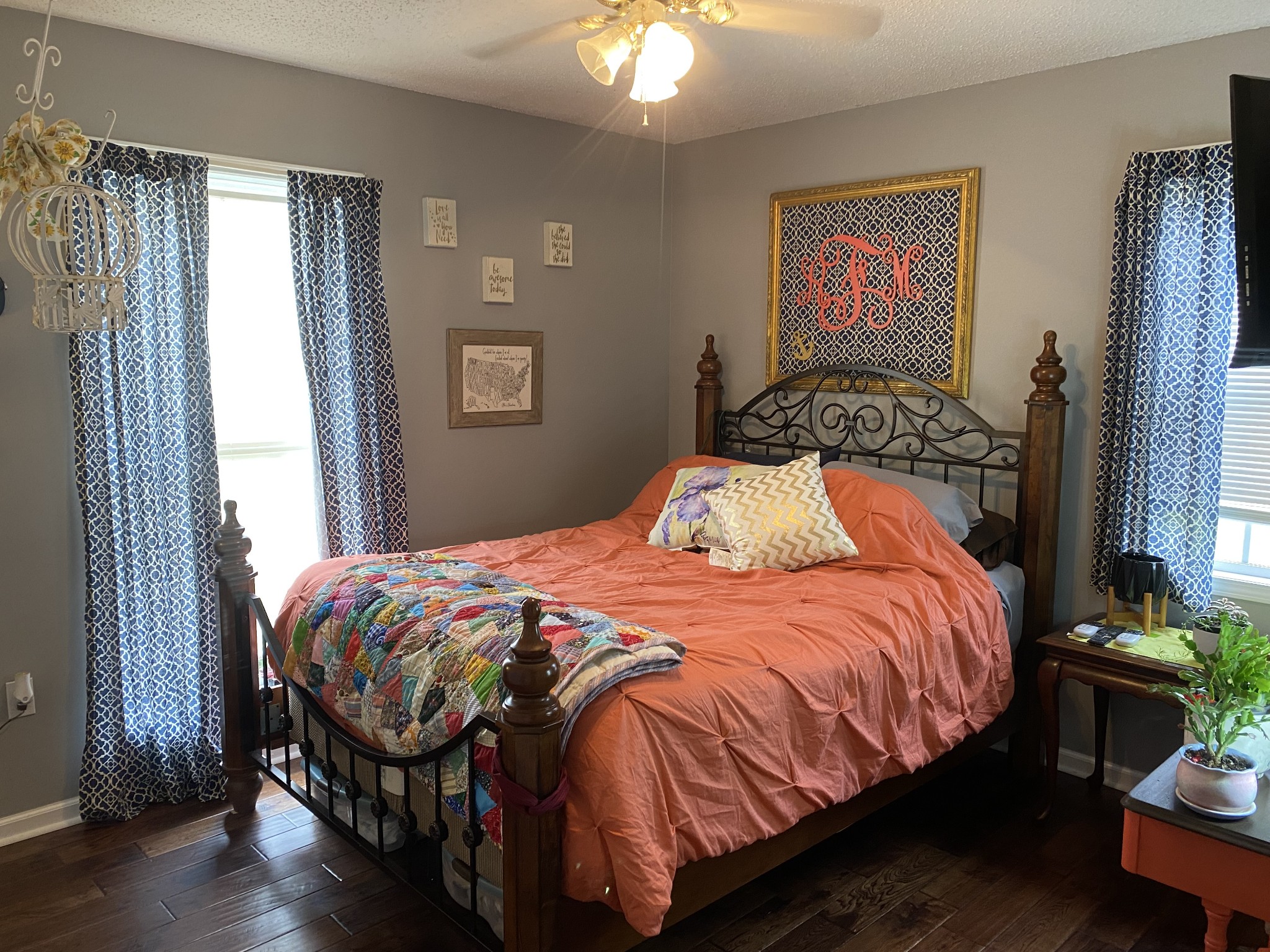 876 Barnette Road Minor Hill, TN 38473 - Photo 15 of 27 a bedroom with a bed and a chandelier
