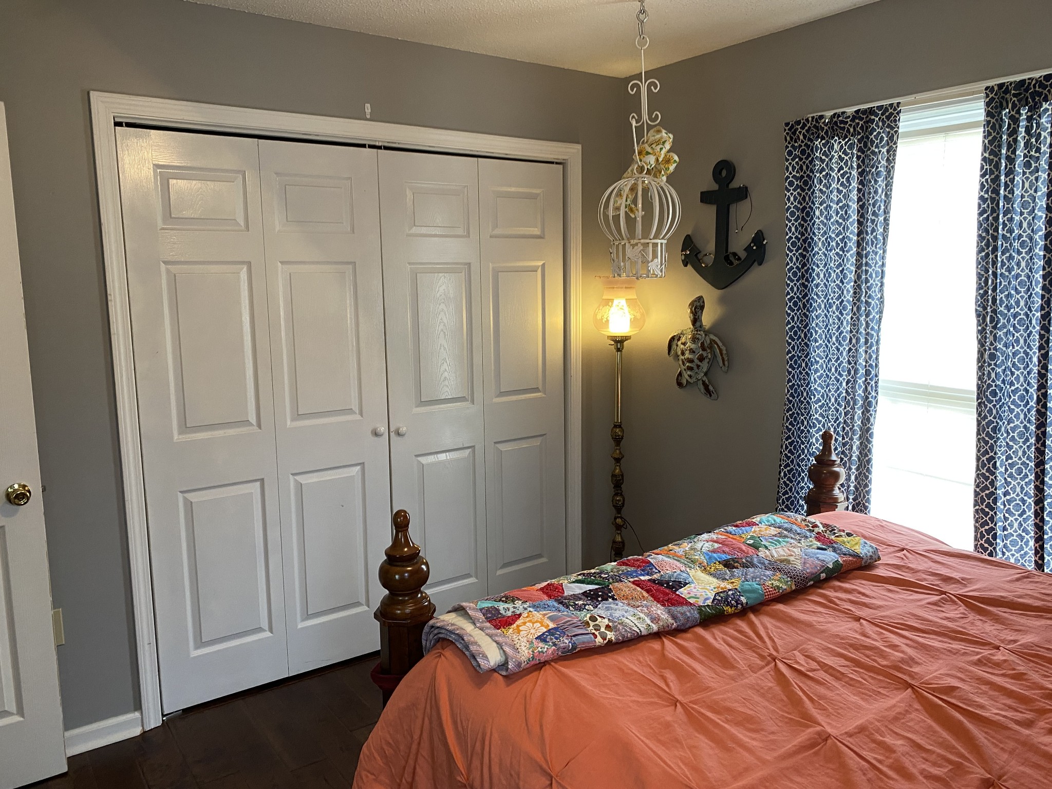 876 Barnette Road Minor Hill, TN 38473 - Photo 16 of 27 a bedroom with a bed and a chandelier