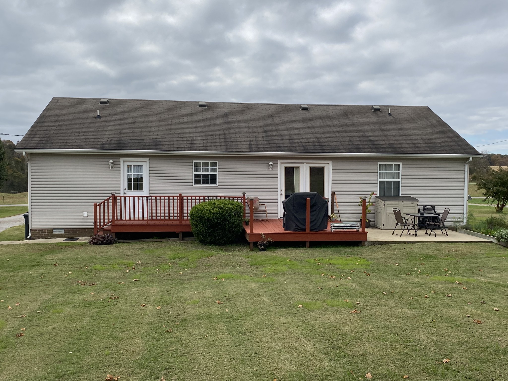 876 Barnette Road Minor Hill, TN 38473 - Photo 20 of 27 a view of a house with backyard porch and furniture