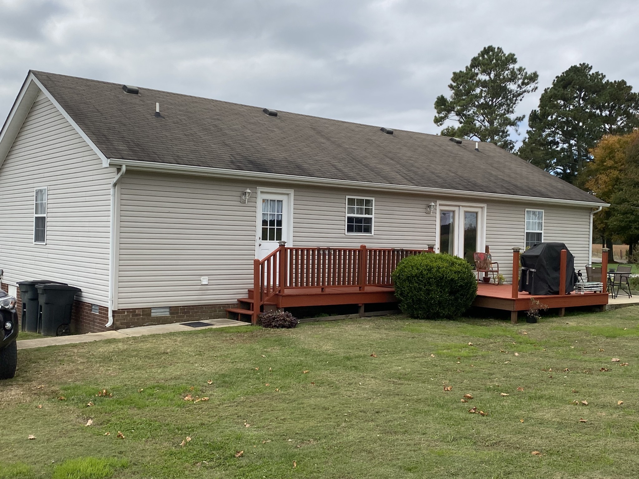 876 Barnette Road Minor Hill, TN 38473 - Photo 21 of 27 a view of a house with a yard and deck