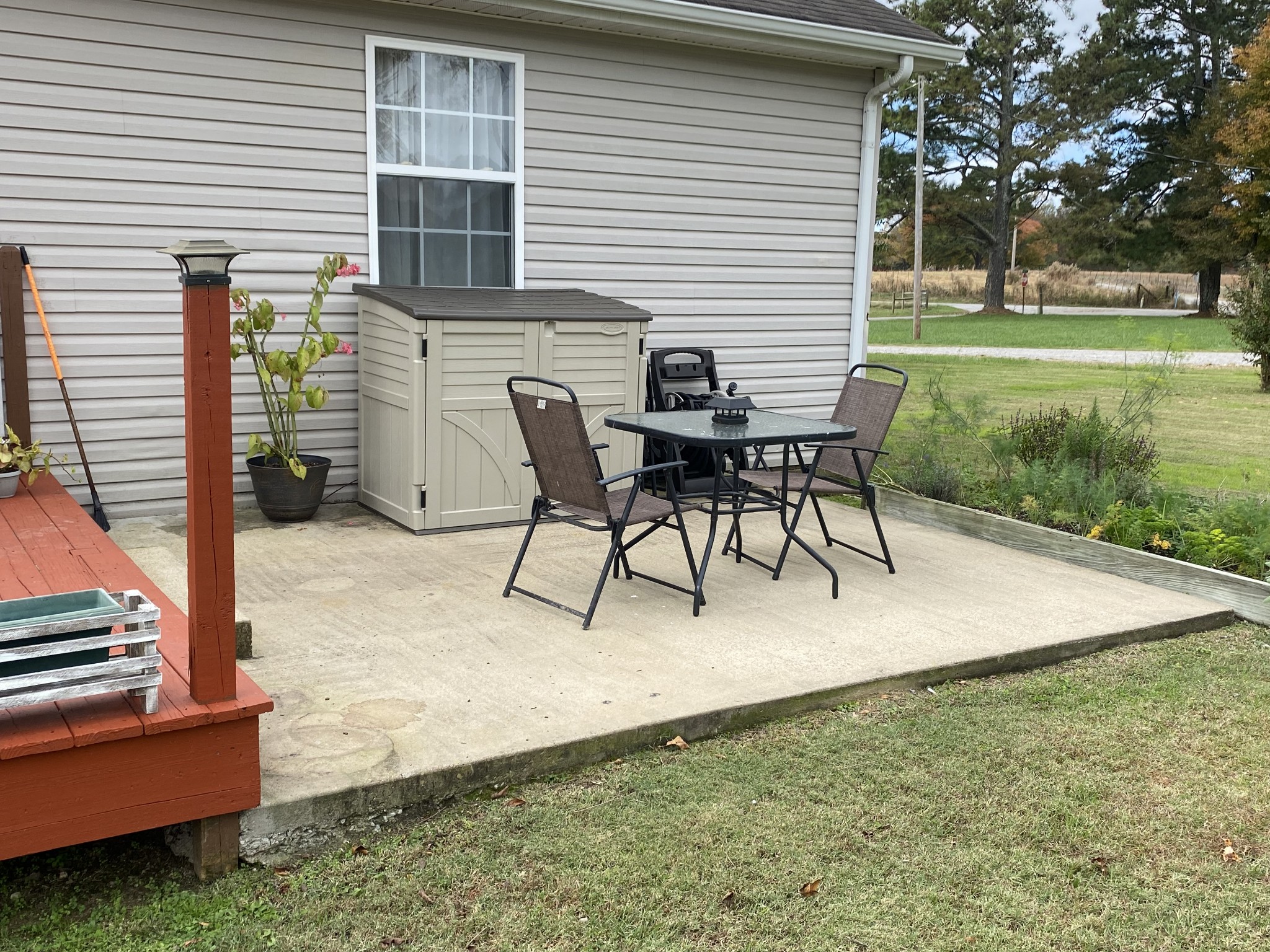 876 Barnette Road Minor Hill, TN 38473 - Photo 23 of 27 a view of a patio with a table and chairs
