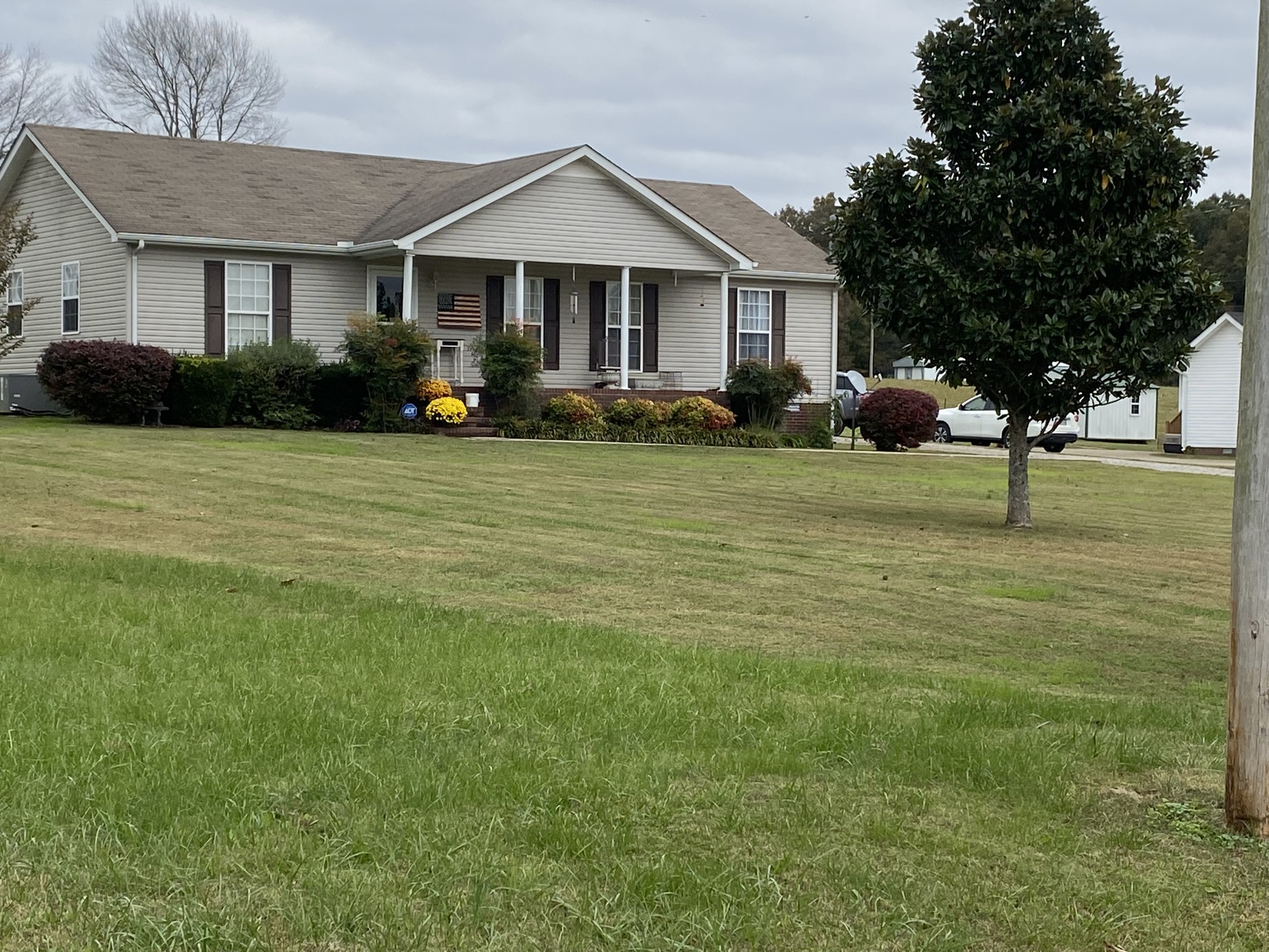 876 Barnette Road Minor Hill, TN 38473 - Photo 26 of 27 a front view of a house with garden