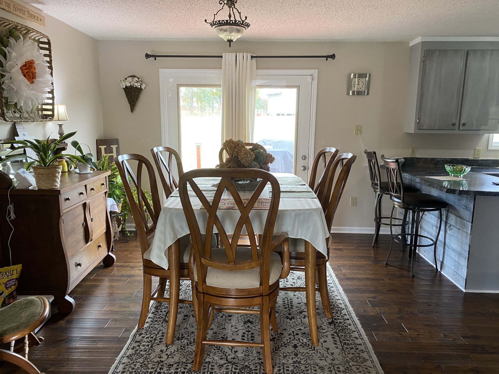 876 Barnette Road Minor Hill, TN 38473 - Photo 4 of 27 a view of a a dining room with furniture window and wooden floor