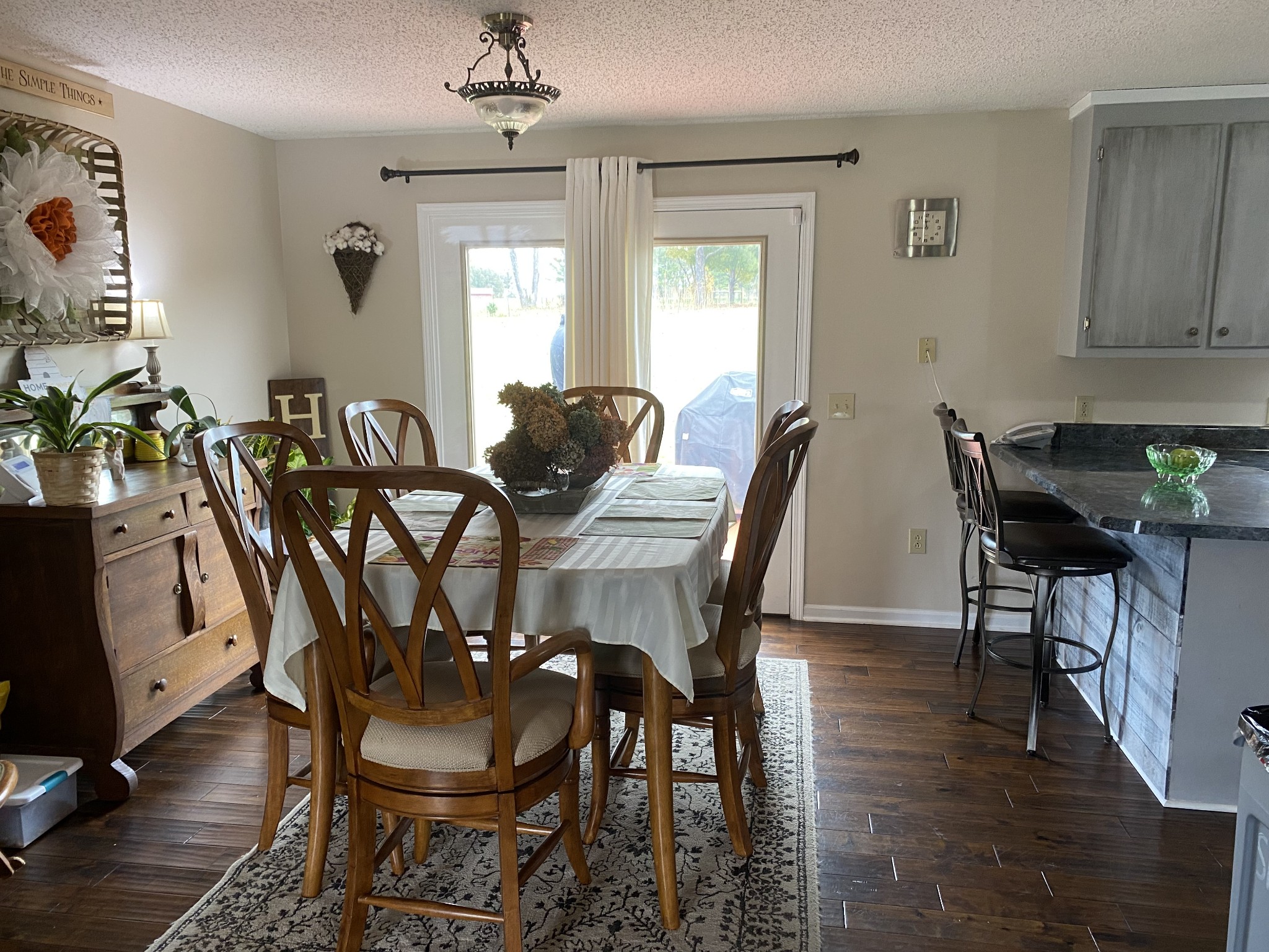 876 Barnette Road Minor Hill, TN 38473 - Photo 5 of 27 a view of a dining room with furniture and wooden floor