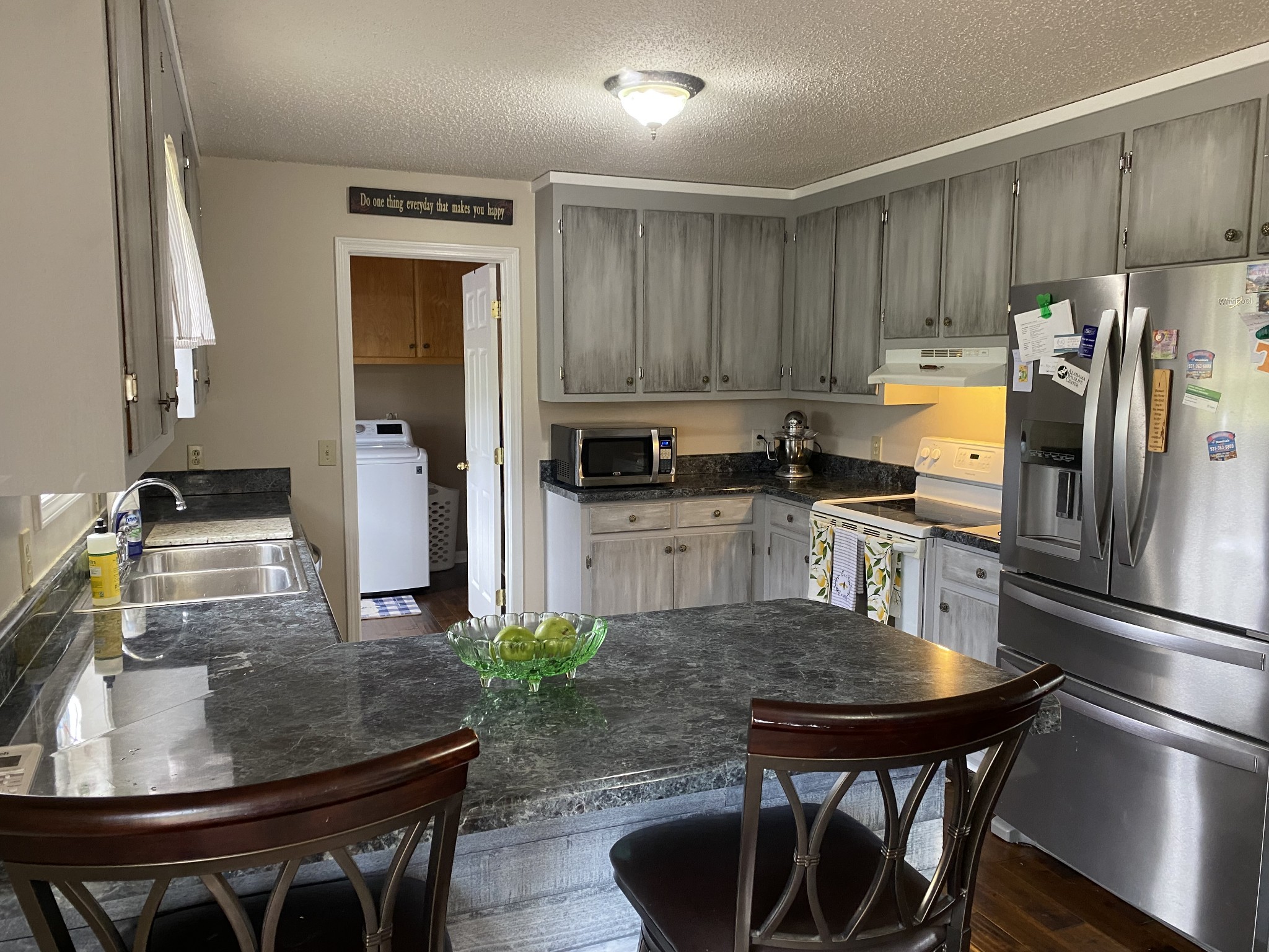 876 Barnette Road Minor Hill, TN 38473 - Photo 6 of 27 a kitchen with kitchen island a sink stove and refrigerator