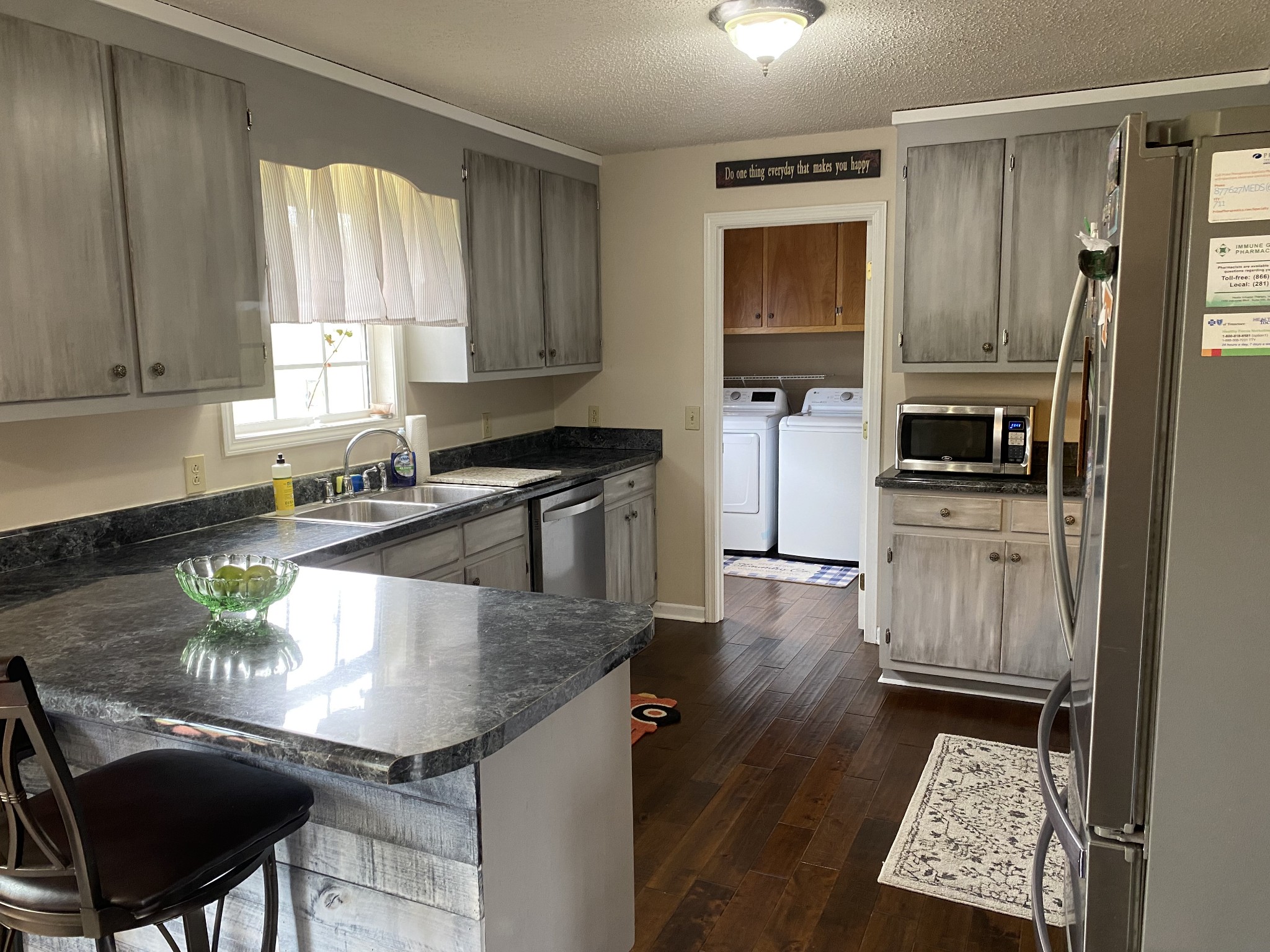 876 Barnette Road Minor Hill, TN 38473 - Photo 7 of 27 a kitchen with granite countertop a stove a sink and a refrigerator