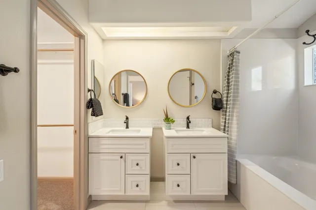 a bathroom with a sink and mirror