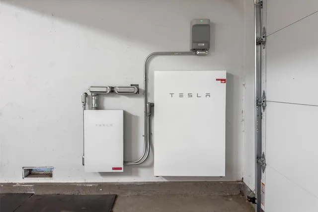 an aerial view of a house a yard and lake view