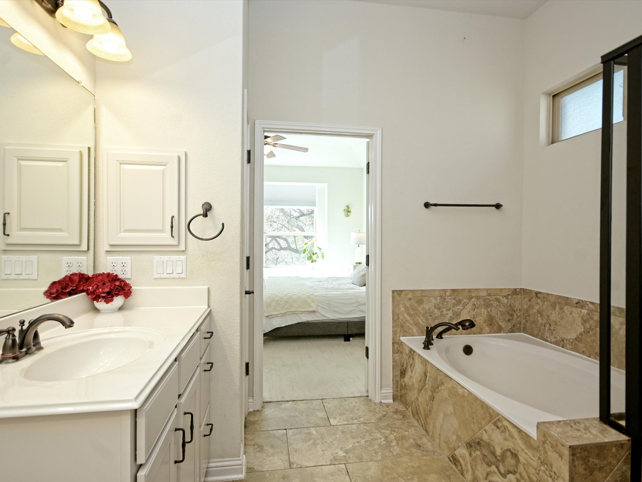 201 Bellagio Drive Austin, TX 78734 - Photo 16 of 31 Excellent counter space on the vanities with fantastic cabinetry storage below each vanity.