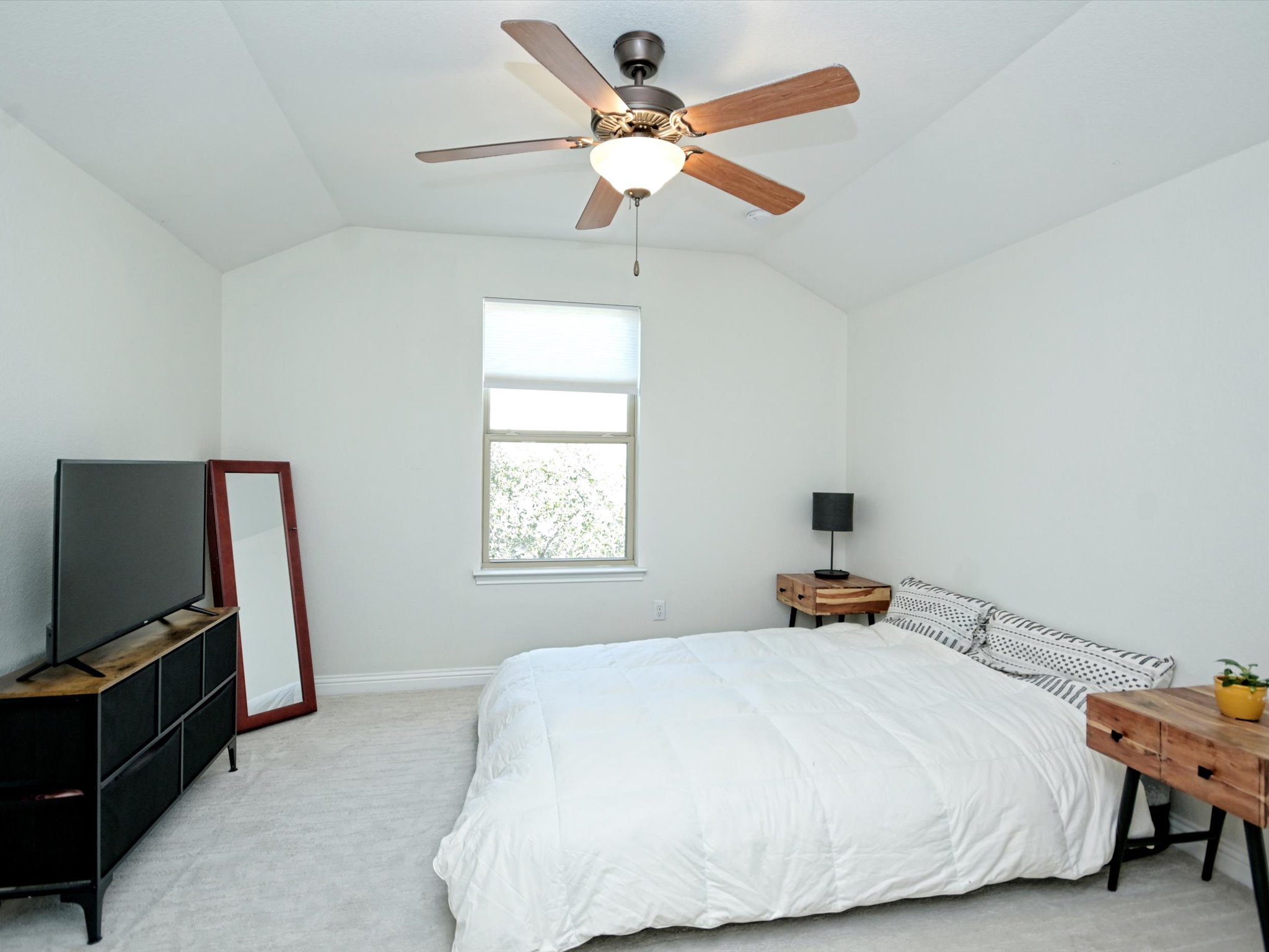 201 Bellagio Drive Austin, TX 78734 - Photo 24 of 31 Upstairs there is also a 4th bedroom under soaring ceilings - perfect for multi-generation living, a home office, teenagers, or guest room.