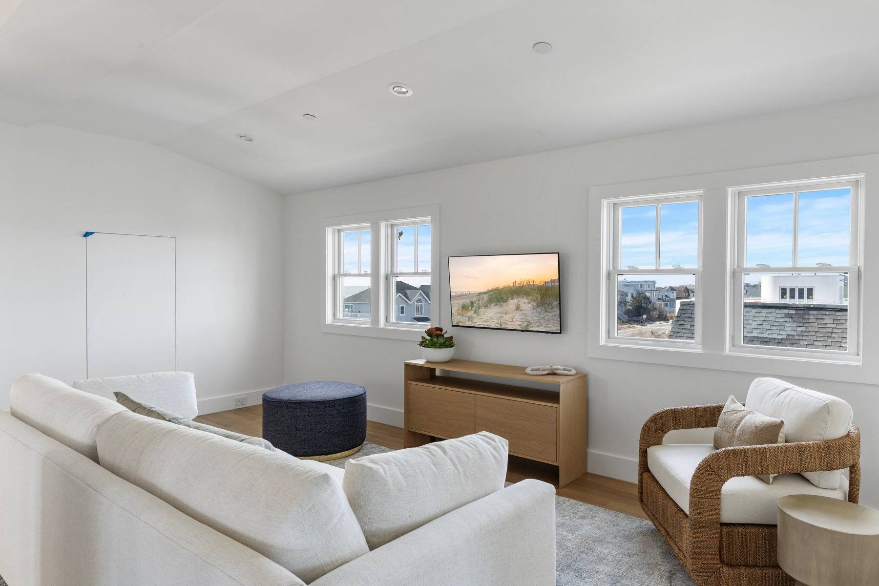 686 Dune Road Westhampton Beach, NY 11978 - Photo 31 of 37 a living room with furniture and a flat screen tv
