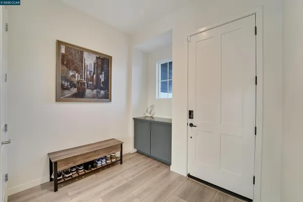 a room with furniture and wooden floor