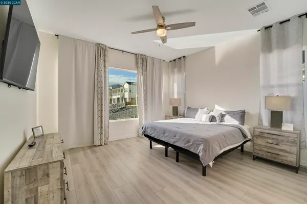 a view of a patio with table and chairs and potted plants