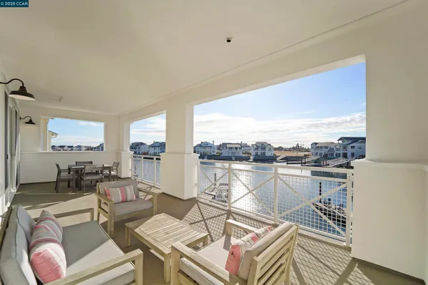 a view of a house with pool and chairs