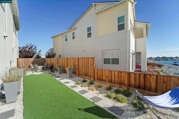 a view of a lake with boats and trees in the background