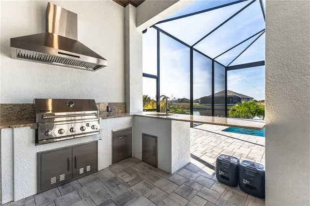 a kitchen with a stove a sink and a refrigerator